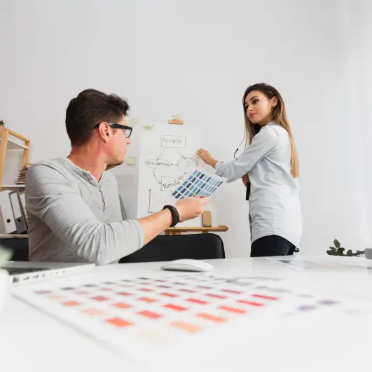 Front view man and woman working on a diagram